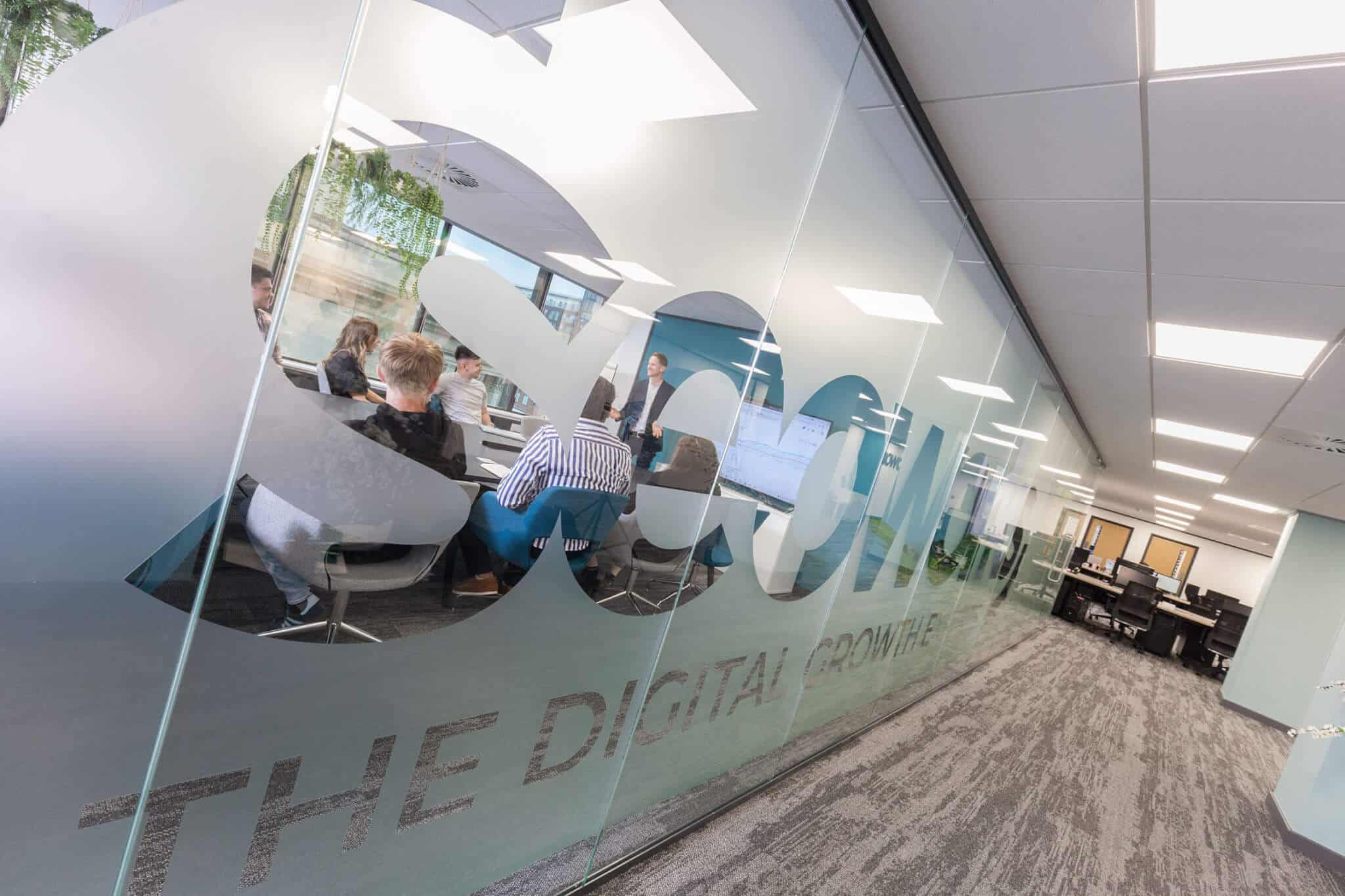 seo works logo on glass wall in brand office
