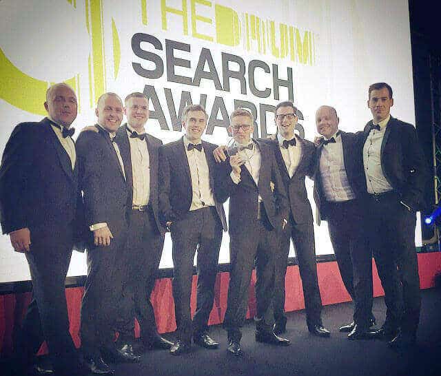 The SEO Works team at The Drum Search Awards with winner trophy